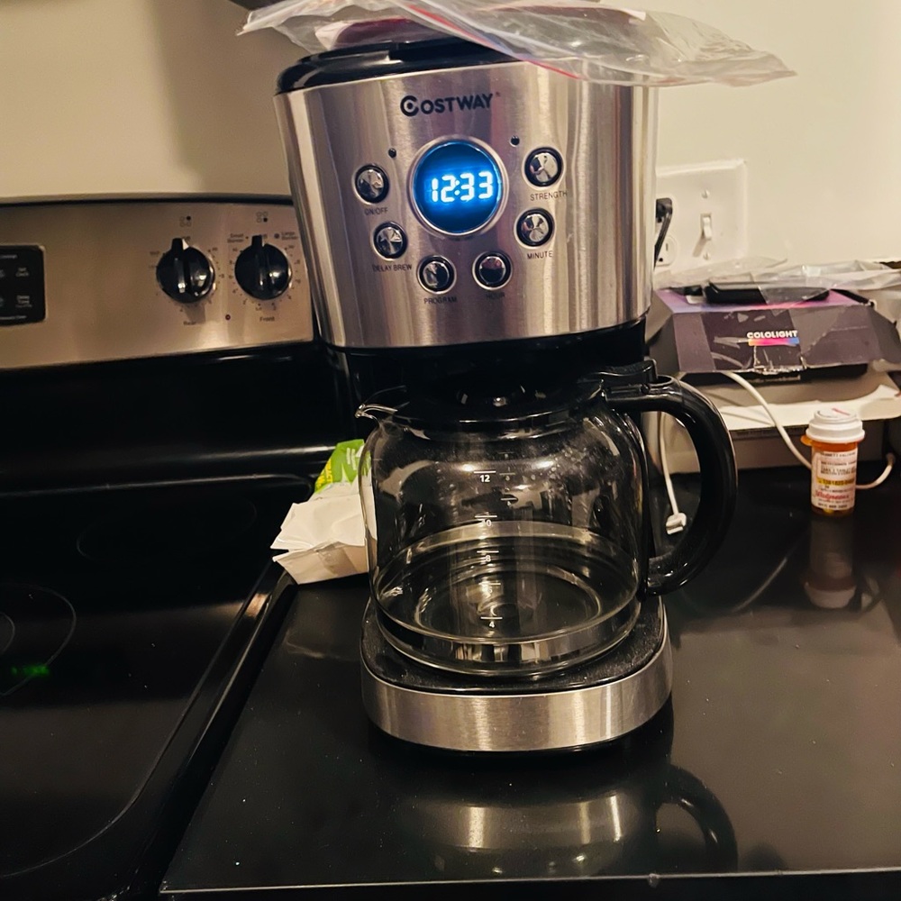 Brand new black and sterling silver coffee machine
